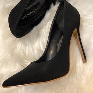 Black pointed toe pumps